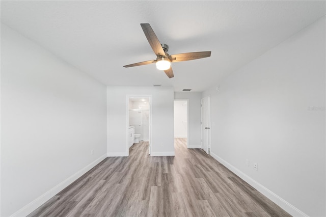 spare room with light hardwood / wood-style floors and ceiling fan