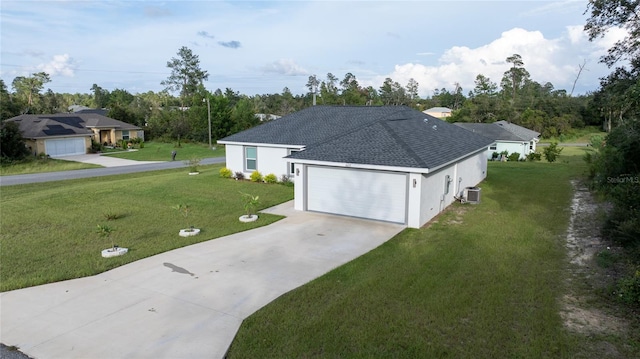 ranch-style house with a front yard, central AC, and a garage