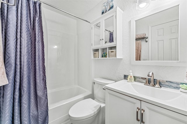 full bathroom with vanity, shower / bath combo, a textured ceiling, and toilet