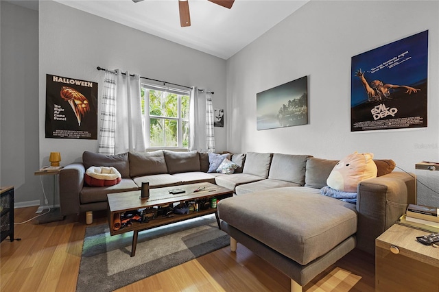 living room with hardwood / wood-style flooring and ceiling fan