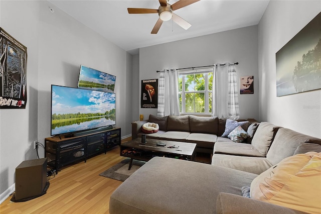 living room with ceiling fan and light hardwood / wood-style floors