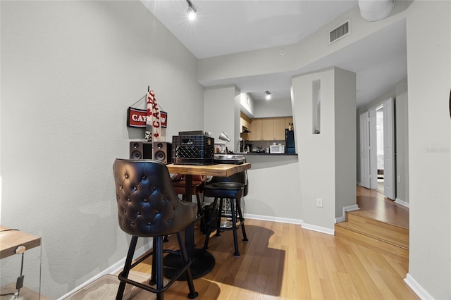 dining space featuring light hardwood / wood-style floors