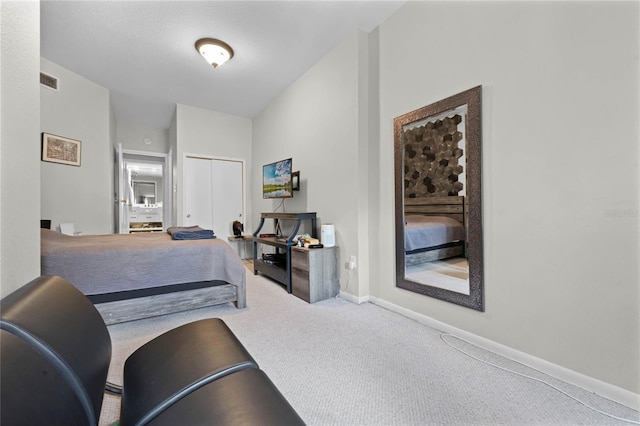 carpeted bedroom featuring a closet