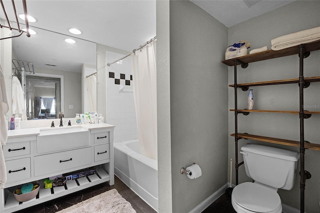 full bathroom featuring vanity, toilet, and shower / bath combo with shower curtain