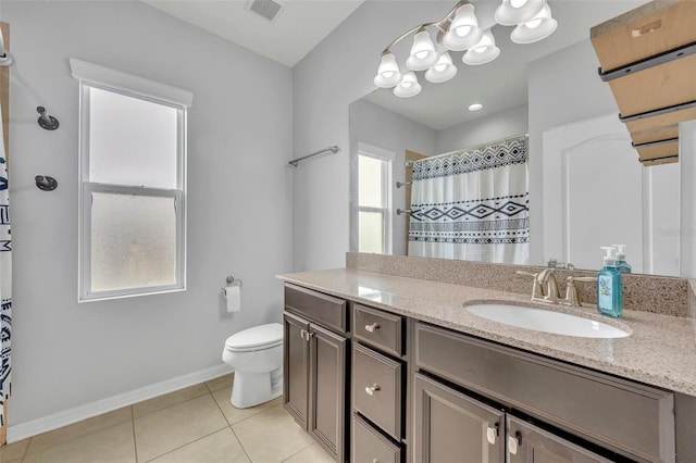 bathroom with vanity, toilet, tile patterned floors, and curtained shower