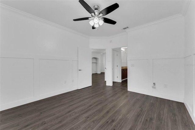 unfurnished living room featuring a decorative wall, ceiling fan, visible vents, ornamental molding, and dark wood-style floors