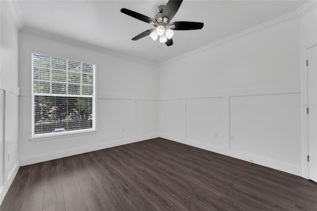 spare room with wainscoting, ceiling fan, dark wood-style floors, and ornamental molding