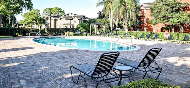community pool featuring a patio area