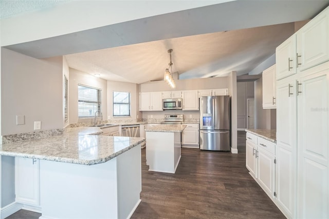 kitchen with sink, kitchen peninsula, white cabinetry, stainless steel appliances, and vaulted ceiling