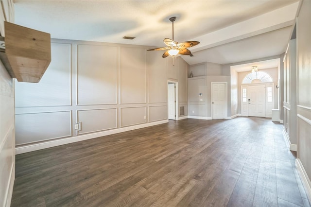 unfurnished living room with lofted ceiling, dark hardwood / wood-style floors, and ceiling fan