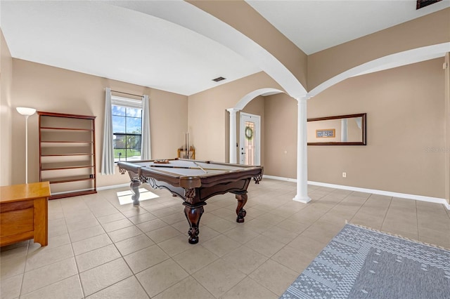 rec room featuring light tile patterned floors, baseboards, arched walkways, visible vents, and ornate columns