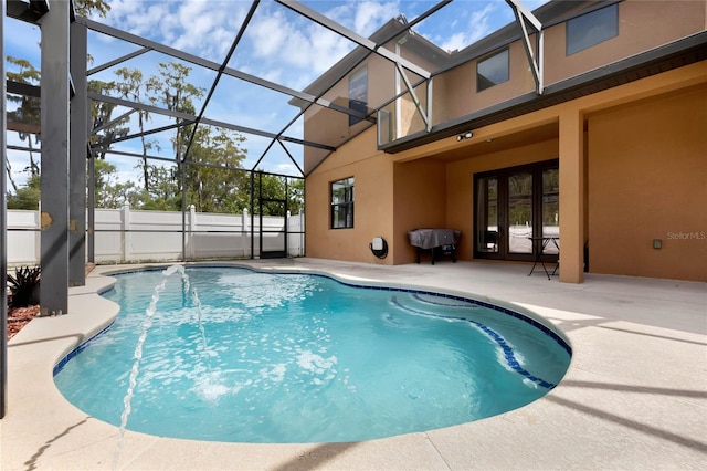 view of pool featuring a patio area and a lanai