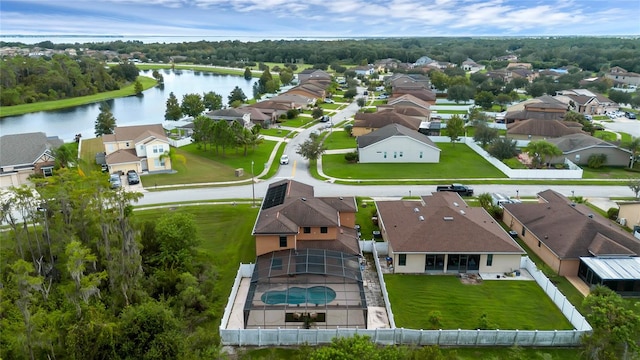 birds eye view of property featuring a water view and a residential view