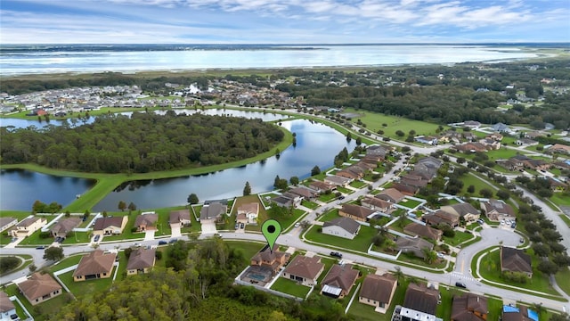 bird's eye view featuring a water view and a residential view