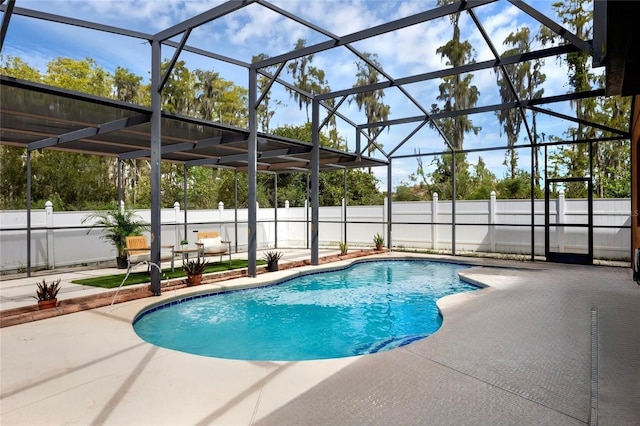 view of swimming pool featuring glass enclosure, fence, a fenced in pool, and a patio