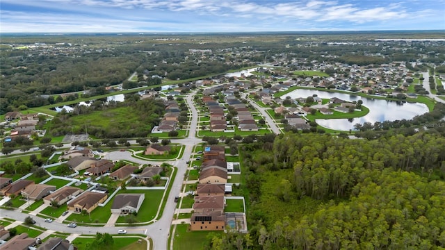 bird's eye view featuring a water view and a residential view