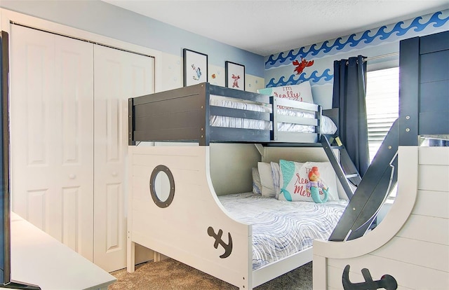 carpeted bedroom with a closet