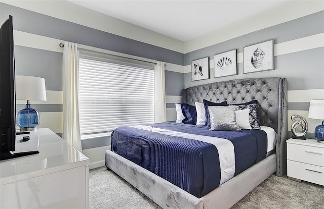 bedroom featuring light colored carpet