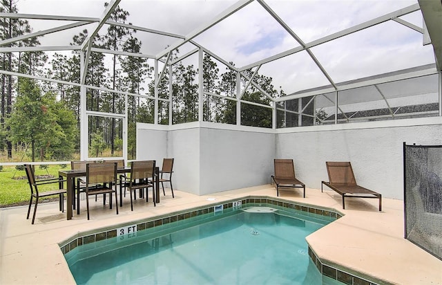 view of pool featuring a patio and a lanai