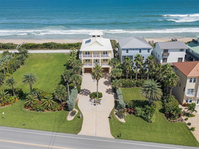 aerial view featuring a water view and a beach view