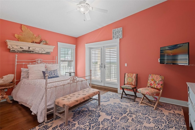 bedroom with hardwood / wood-style flooring, vaulted ceiling, and ceiling fan