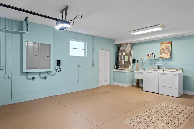 laundry area featuring light tile patterned floors, electric panel, heating unit, and washing machine and clothes dryer