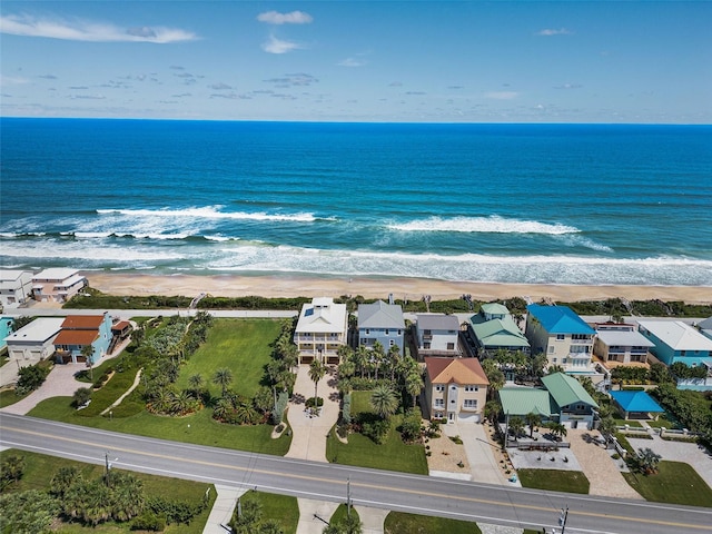 aerial view featuring a water view and a beach view