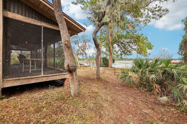 view of yard with a sunroom