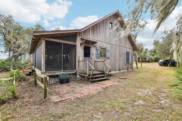 rear view of house with a sunroom