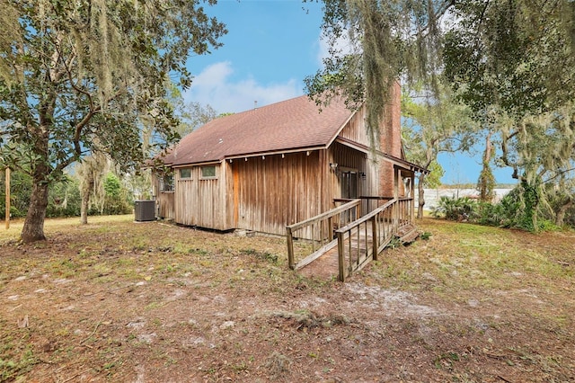 view of side of property with central AC