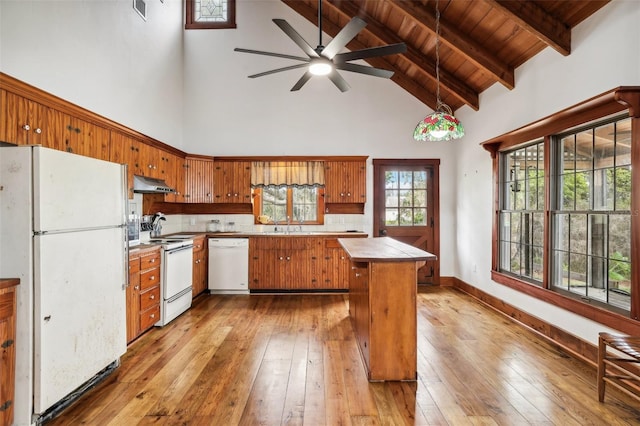 kitchen featuring a ceiling fan, white appliances, under cabinet range hood, brown cabinets, and light wood-style flooring