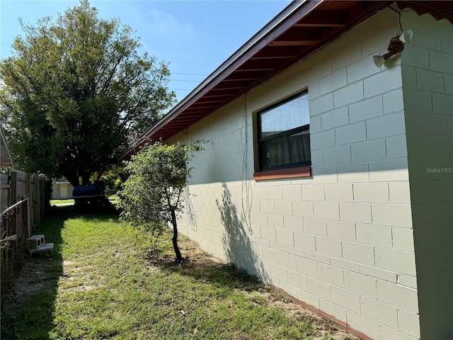 view of home's exterior with a yard