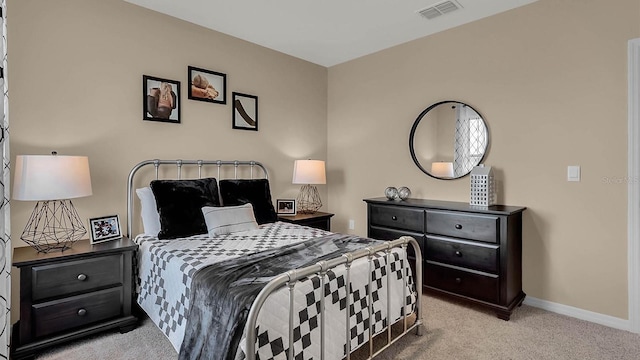 bedroom with light carpet