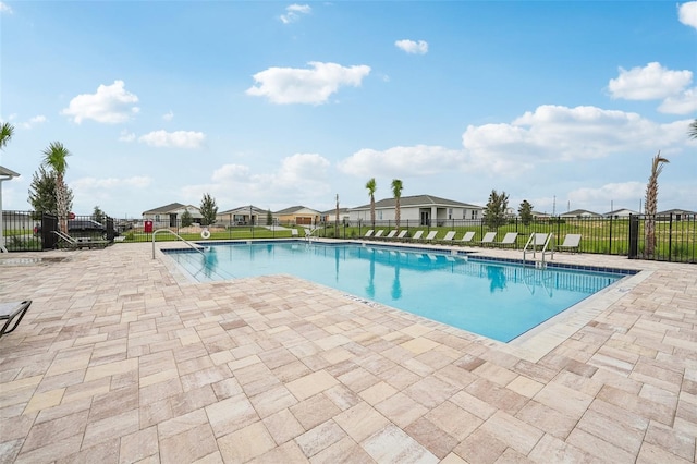 view of swimming pool with a patio area