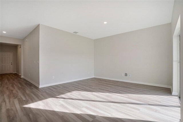 unfurnished room featuring light wood-type flooring