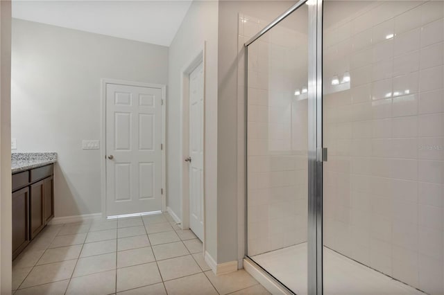 bathroom with vanity, tile patterned floors, and walk in shower