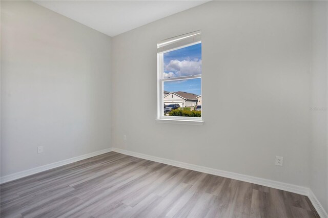 spare room featuring light hardwood / wood-style flooring