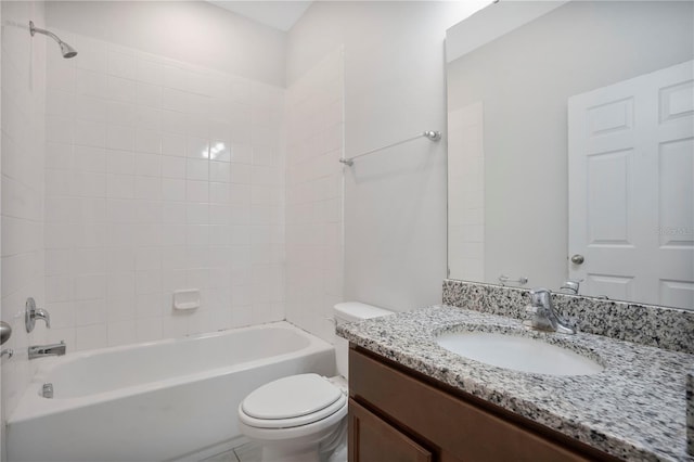 full bathroom featuring vanity, toilet, and tiled shower / bath