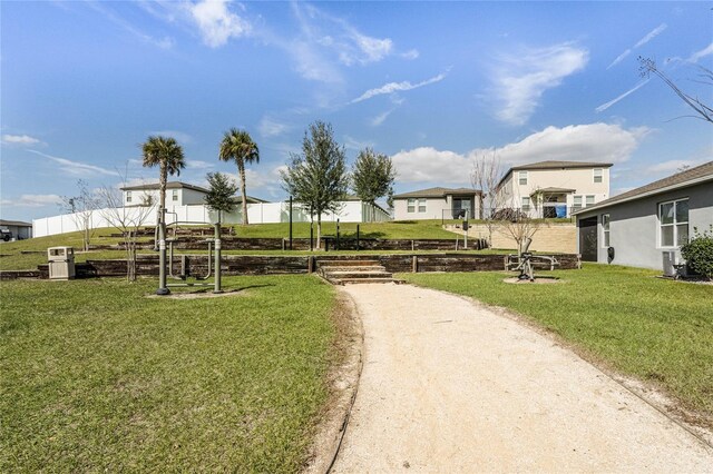 view of home's community featuring a yard