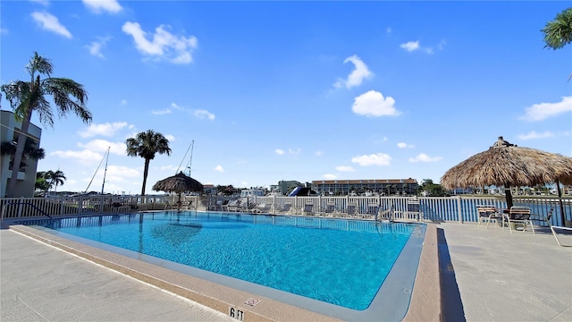 view of swimming pool with a water view