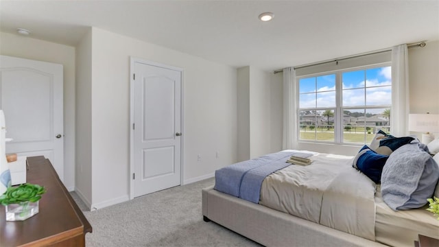 bedroom featuring light colored carpet