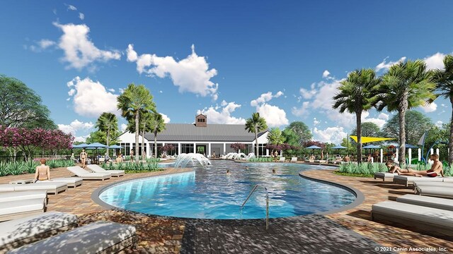 view of pool featuring a patio and pool water feature