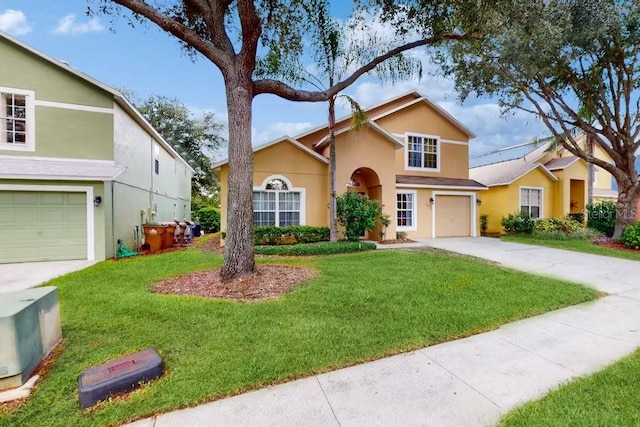 view of front property featuring a garage and a front lawn