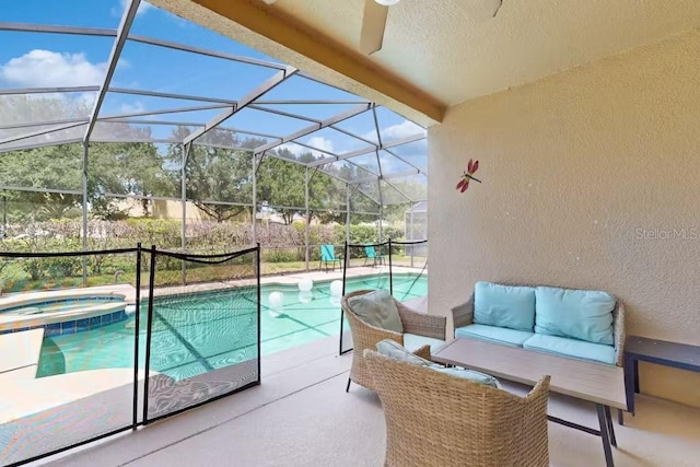 view of pool featuring a patio area, outdoor lounge area, an in ground hot tub, and glass enclosure