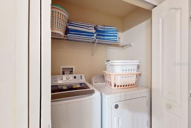 washroom with separate washer and dryer