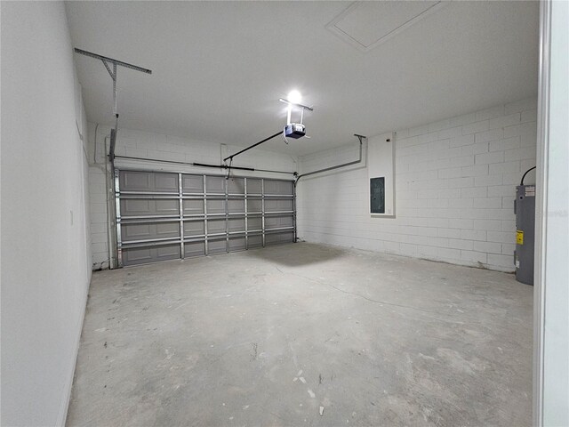 garage with a garage door opener and water heater