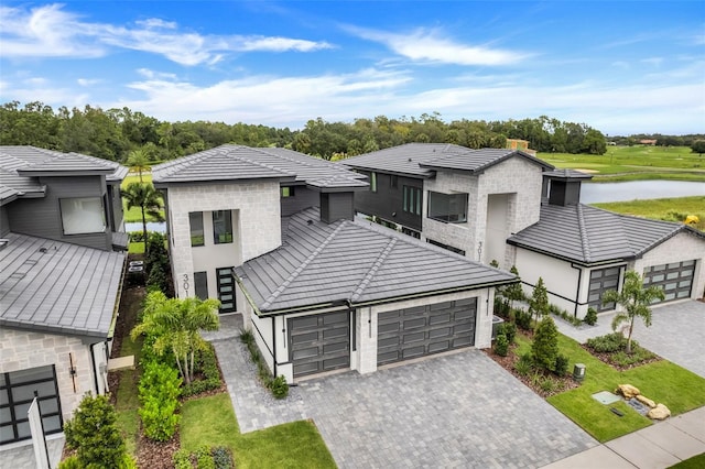 view of front of house featuring a water view and a garage