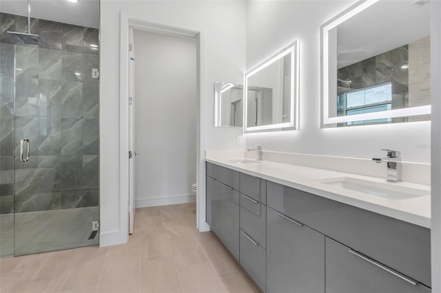 bathroom featuring vanity, toilet, tile patterned flooring, and a shower with door