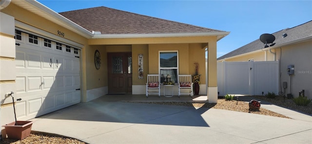 property entrance with covered porch and a garage