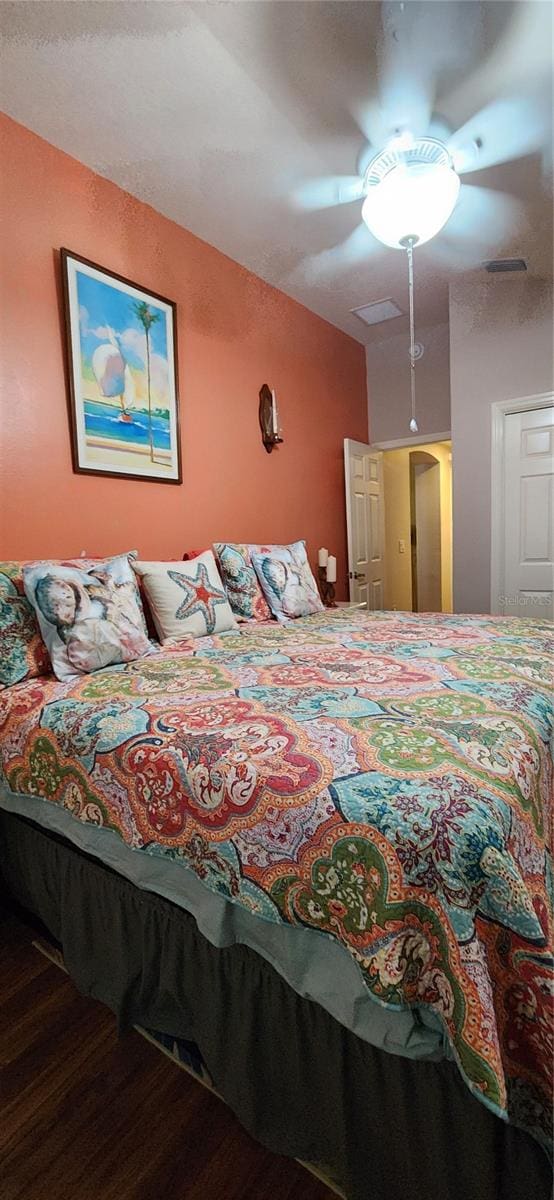 bedroom featuring hardwood / wood-style flooring and ceiling fan